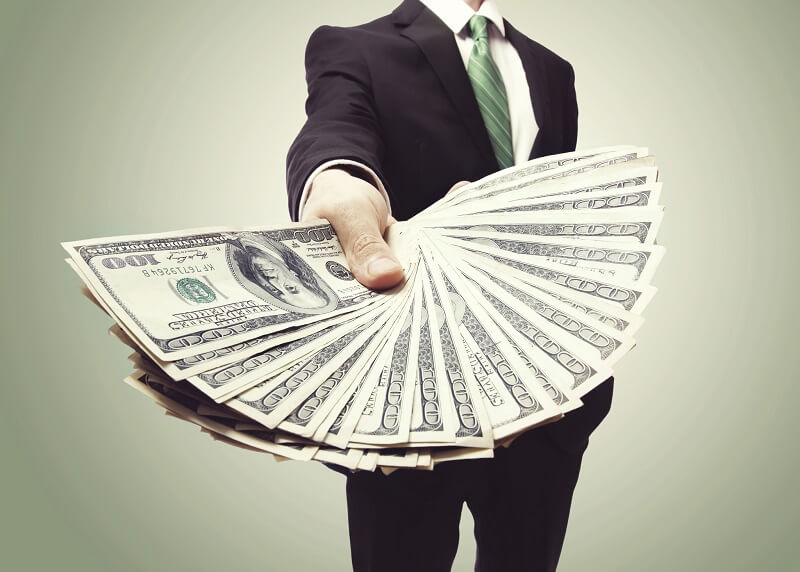 Man-Holding-Money-Thinkstock